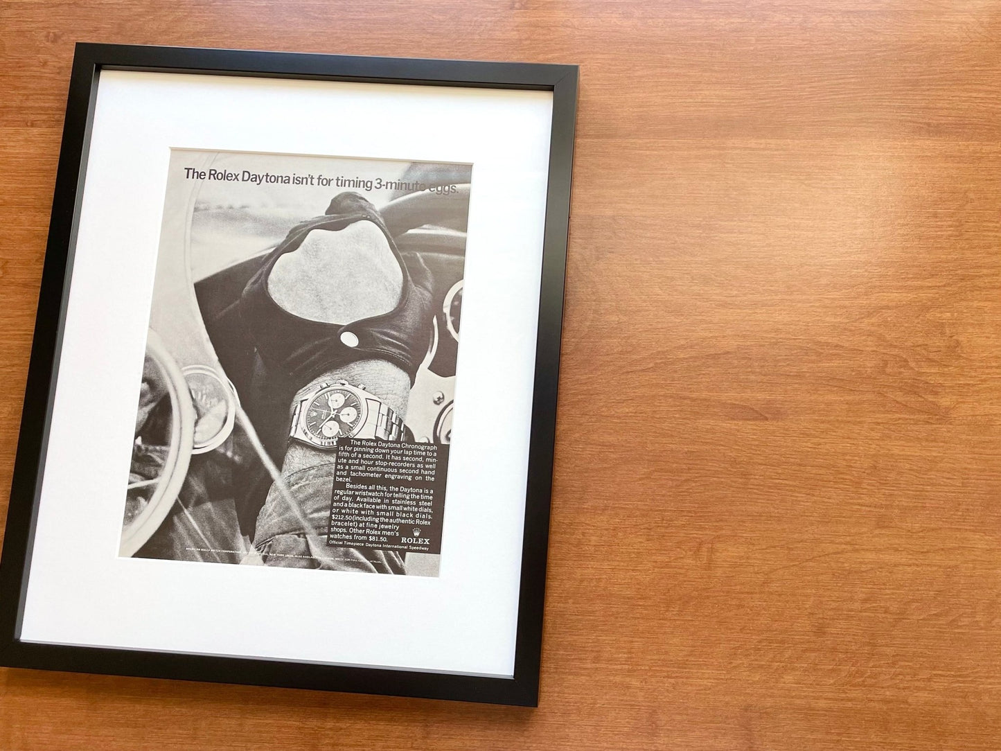 1967 Rolex Daytona "isn't for timing 3 - minute eggs." Advertisement in Black Wood Frame