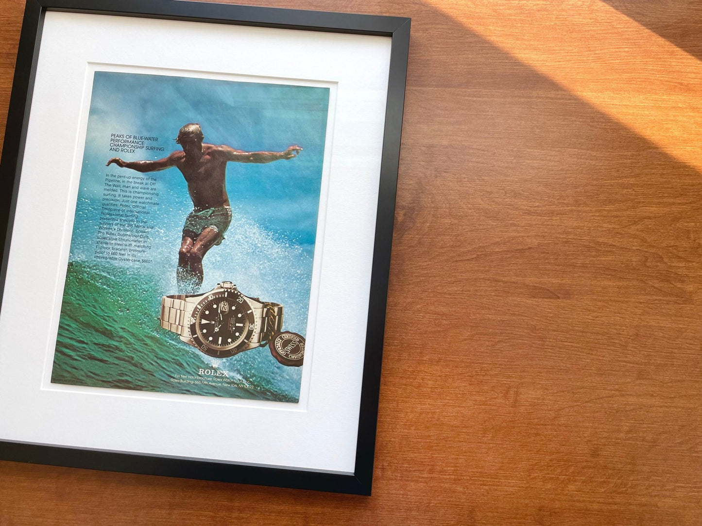 1978 Rolex "Red" Submariner Ref. 1680 with Surfer Advertisement in Black Wood Frame