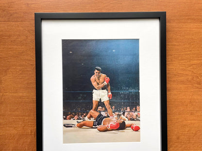 1965 Muhammad Ali "knocks out" Sonny Liston Original Magazine Page Image in Black Wood Frame