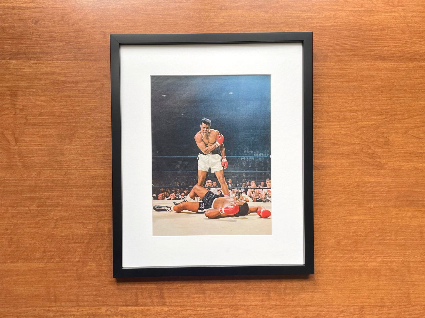 1965 Muhammad Ali "knocks out" Sonny Liston Original Magazine Page Image in Black Wood Frame