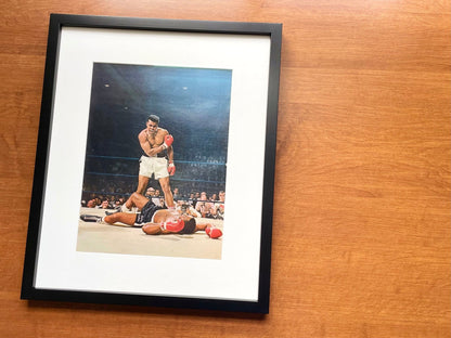 1965 Muhammad Ali "knocks out" Sonny Liston Original Magazine Page Image in Black Wood Frame