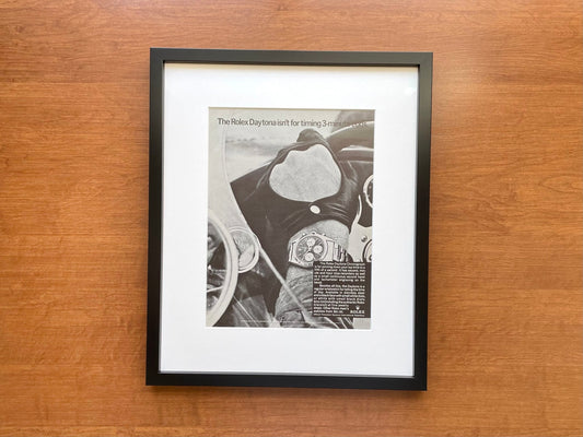1967 Rolex Daytona "isn't for timing 3 - minute eggs." Advertisement in Black Wood Frame