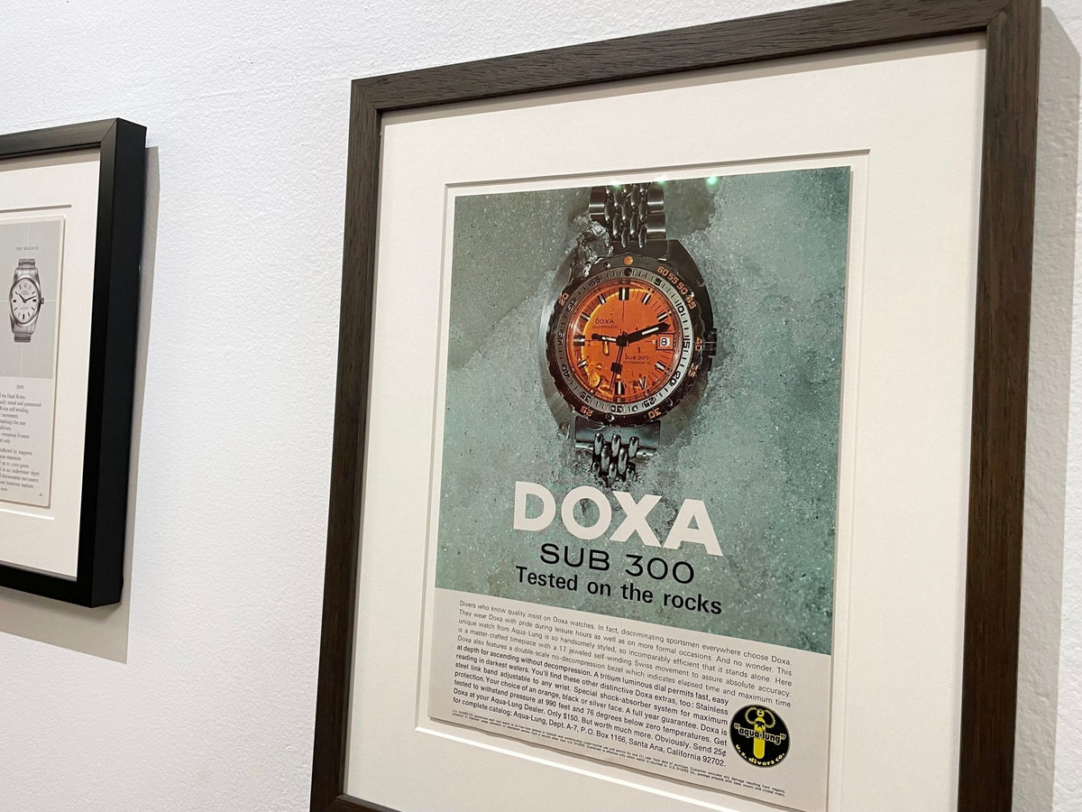 1968 Doxa SUB 300 "Tested on the rocks" Advertisement in Brown Wood Frame