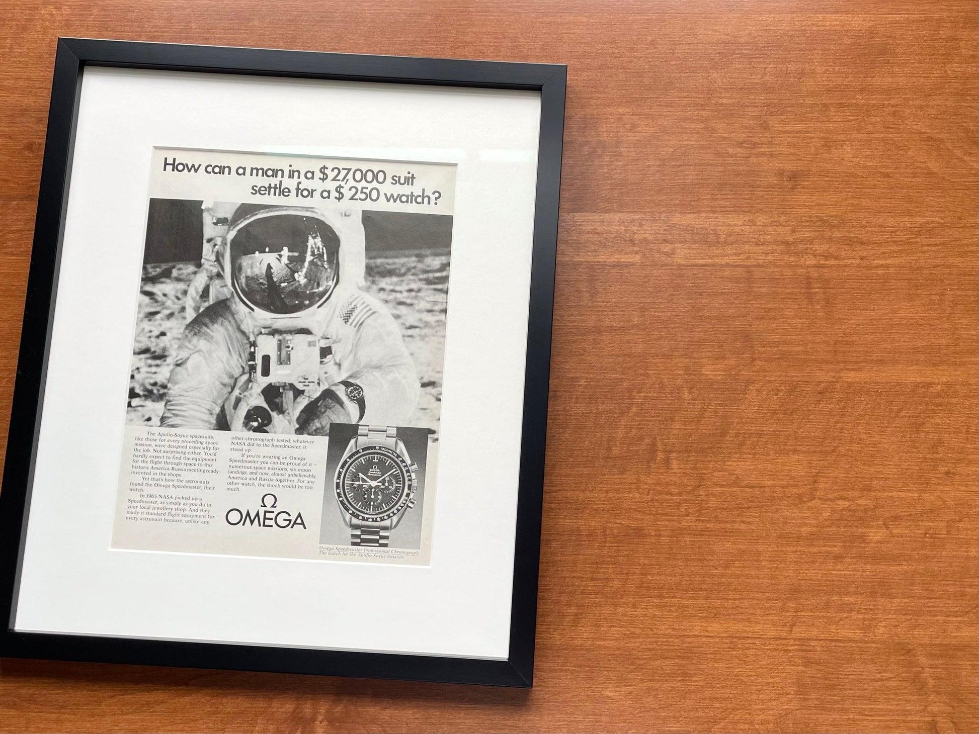 1975 Omega Speedmaster "man in a $27,000 suit..." Advertisement in Black Wood Frame