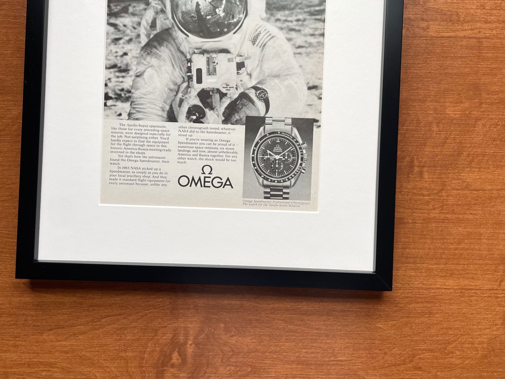 1975 Omega Speedmaster "man in a $27,000 suit..." Advertisement in Black Wood Frame
