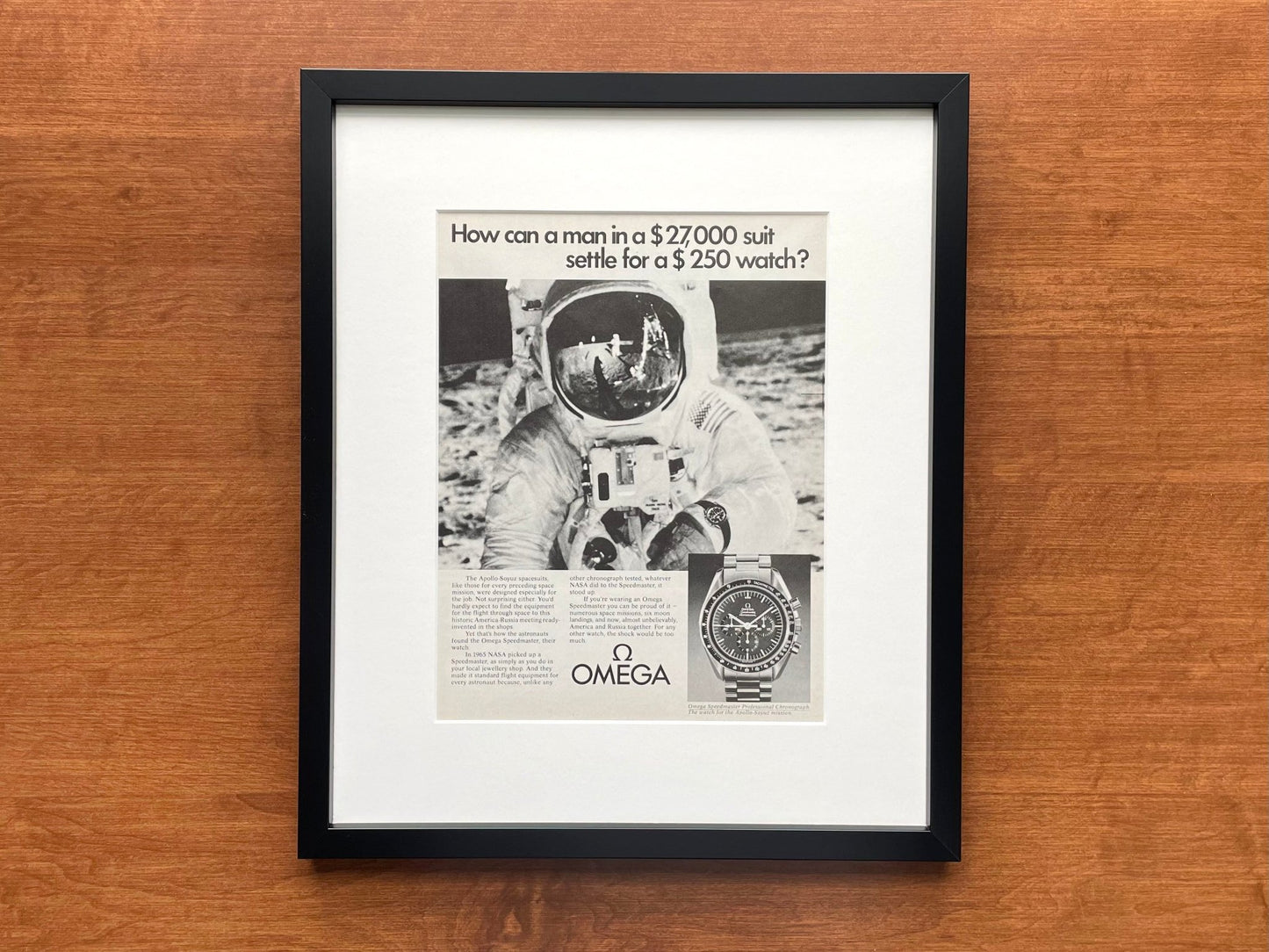 1975 Omega Speedmaster "man in a $27,000 suit..." Advertisement in Black Wood Frame