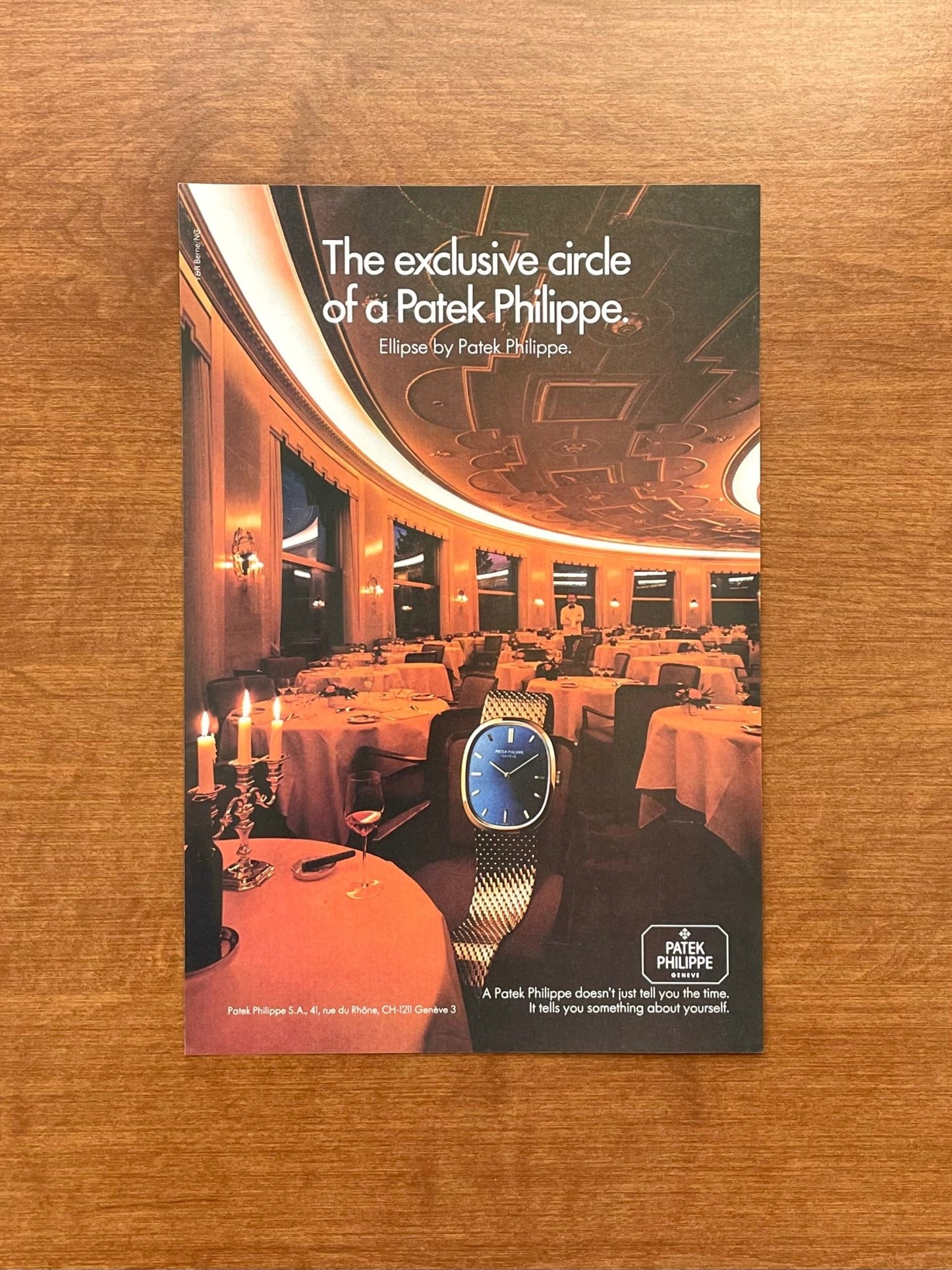 1982 Patek Philippe Ellipse "exclusive circle" in restaurant Advertisement