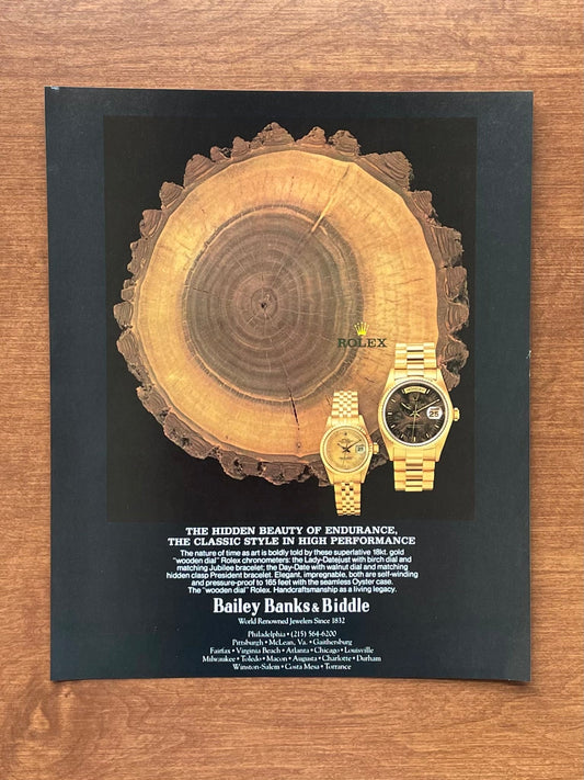 1982 Rolex Day Date Ref. 18038 w/ Walnut "Wood" dial Bailey Banks & Biddle Advertisement