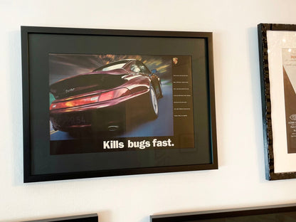 1995 Porsche 911 Turbo "Kills bugs fast." Advertisement in Black Wood Frame