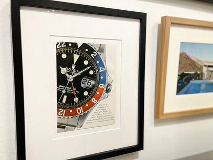 Original Rolex Catalog Page featuring GMT Master Ref. 1675 image in Black Wood Frame
