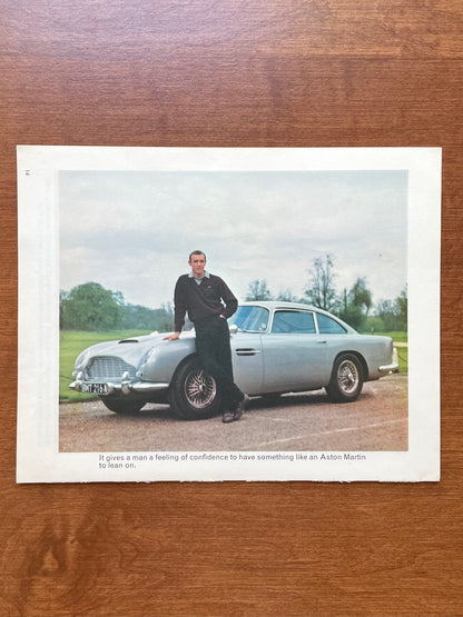 1966 James Bond 007 leaning on Aston Martin DB5 Original Magazine Page Image